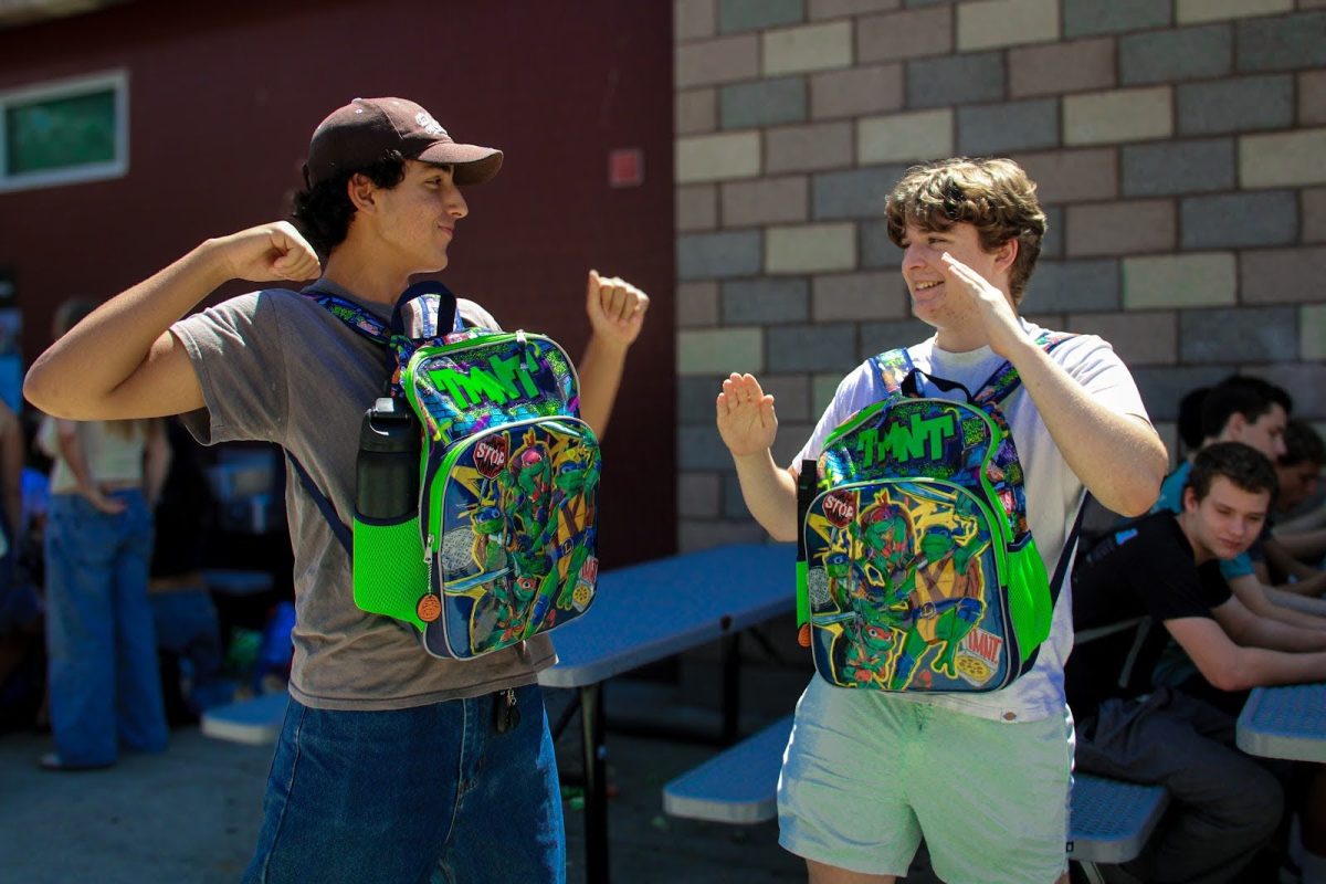 Two best friends revisit their childhood in their senior year by showing off their matching Ninja Turtle backpacks. The TMNT franchise has been a cornerstone of many Gen Z Childhoods. 