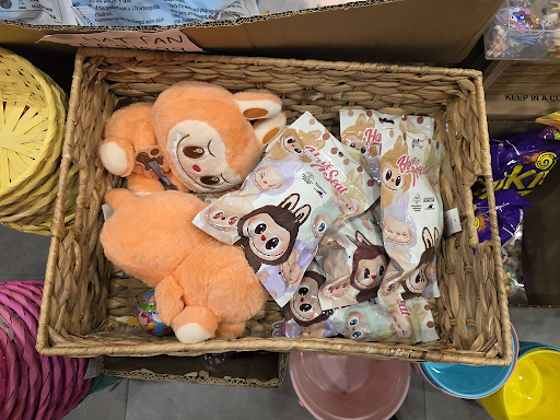 Labubus sitting in a basket for purchase. Labubus can be found in almost any collectible store. 
