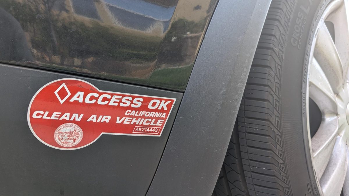 A HOV lane access sticker is placed on the side of Obenshain’s car. Before Oct. 30, those driving in an electric vehicle would be able to use the carpool lane even with only one person in the car.
