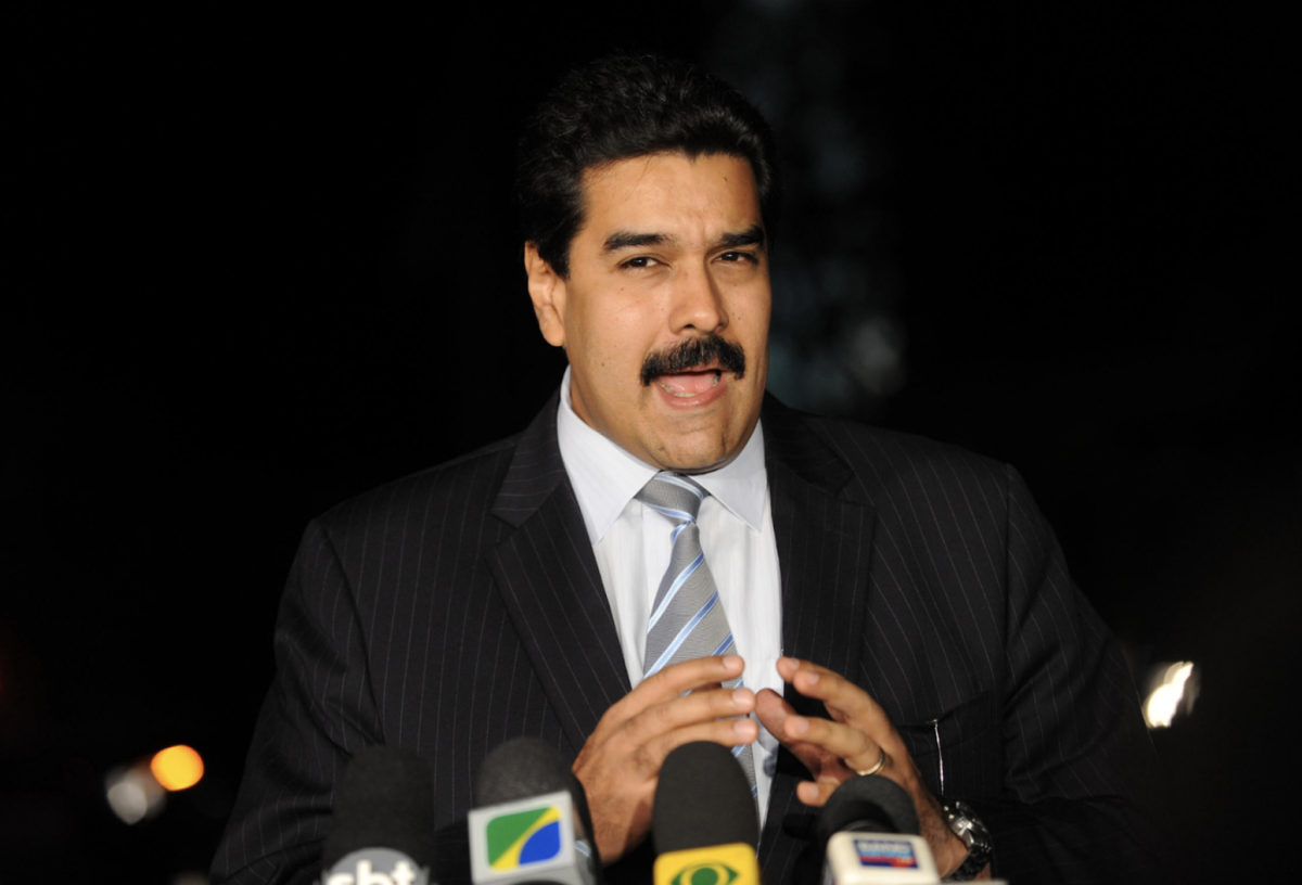 Then foreign minister Maduro speaks to the press after meeting with President Lula of Brazil. Maduro is seen speaking intently into the camera with gesturing hands.
