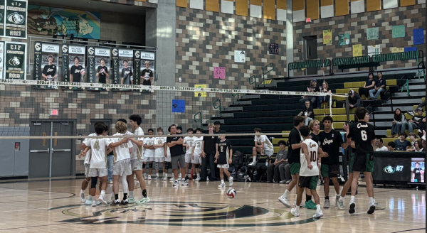 Varsity encourages each other when they lose the point. They are getting ready to receive the serve as they play their game against Westview.