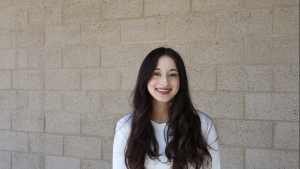 Senior Suhani Singh poses outside of Señor Kramar's room. She is preparing to graduate in a few days and enjoys her last day at school.